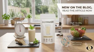 ureNourish Partner.co functional shake prepared with berries and plant milk in an elegant glass